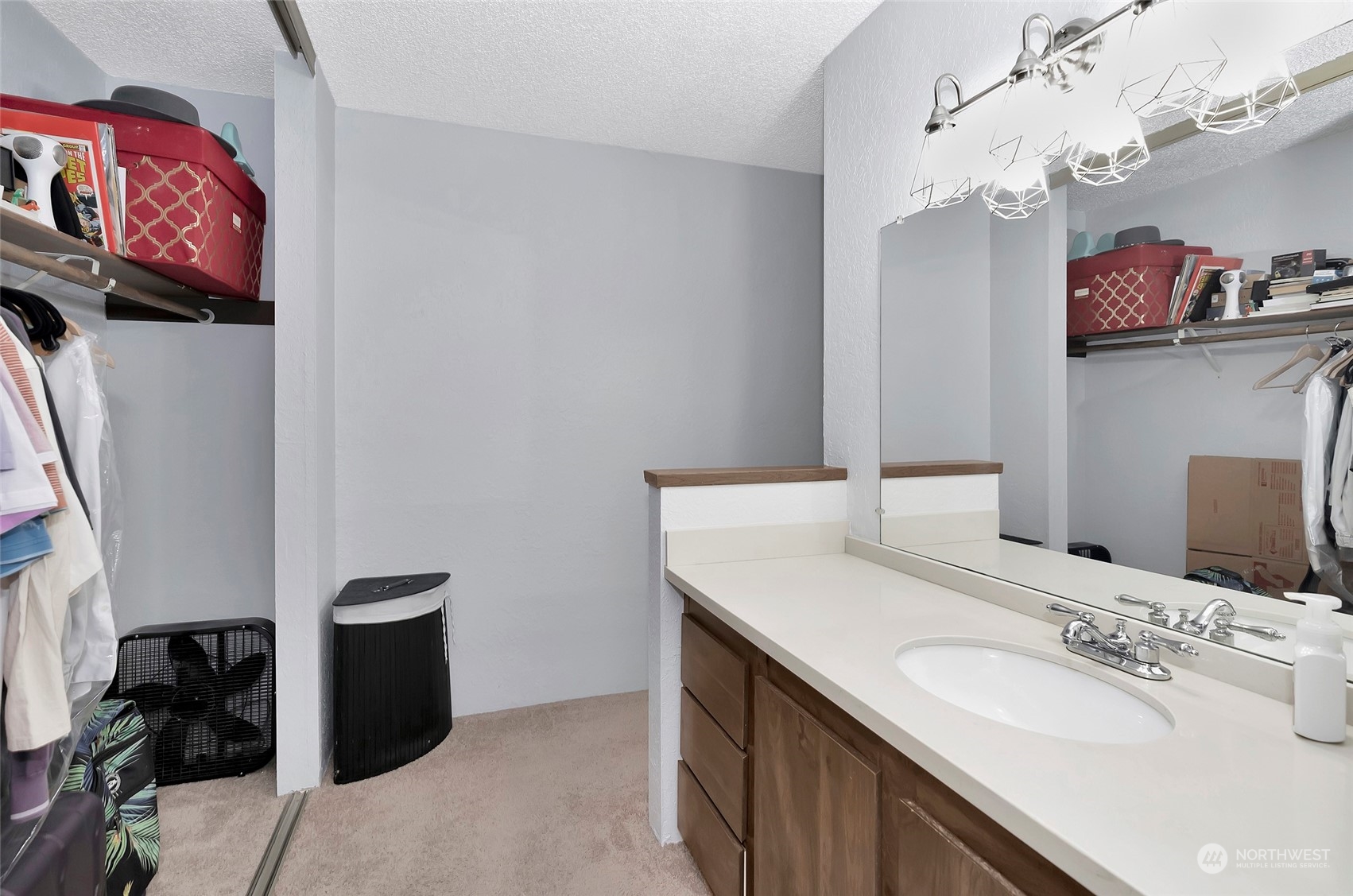14401 Southeast Petrovitsky Road, Unit E205 Renton, WA 98058 - Photo 19 of 28 a bathroom with a sink double vanity and a mirror