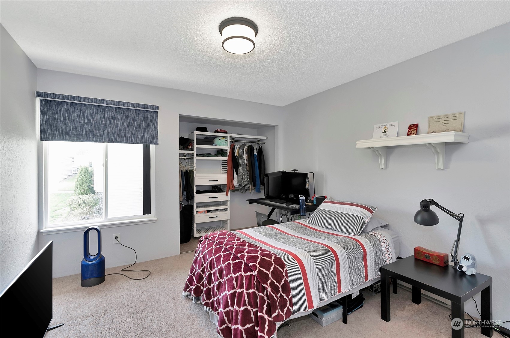 14401 Southeast Petrovitsky Road, Unit E205 Renton, WA 98058 - Photo 20 of 28 a bedroom with bed and a window
