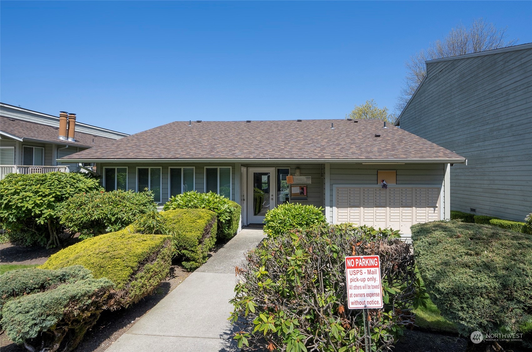 14401 Southeast Petrovitsky Road, Unit E205 Renton, WA 98058 - Photo 26 of 28 a front view of a house with garden