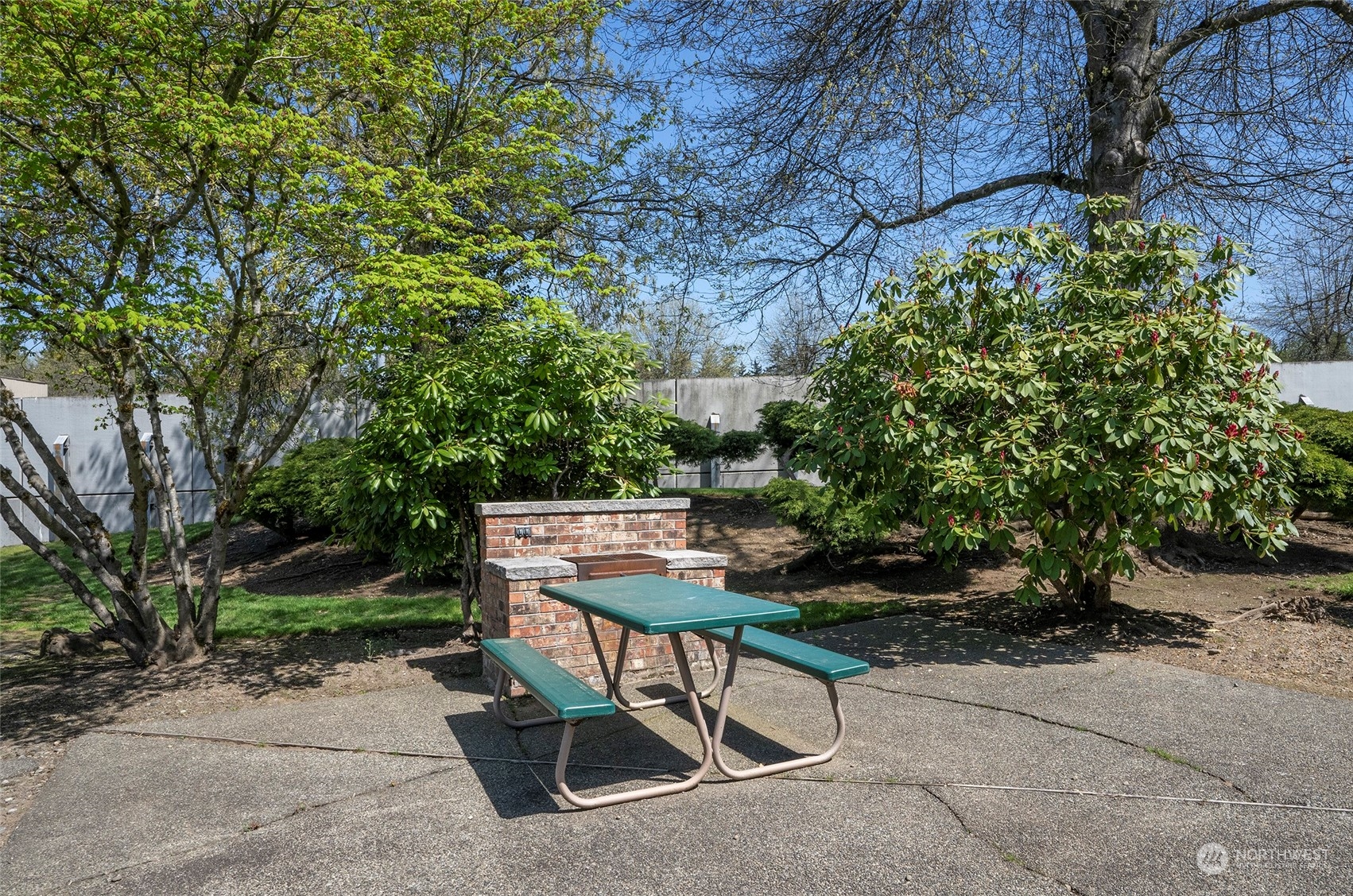 14401 Southeast Petrovitsky Road, Unit E205 Renton, WA 98058 - Photo 27 of 28 a view of a backyard with sitting area