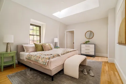 a bedroom with a bed and a table