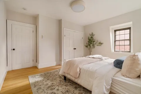 a bedroom with bed and window