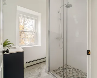 a living room with furniture and a rug
