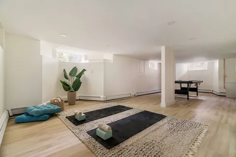a view of kitchen with furniture and wooden floor