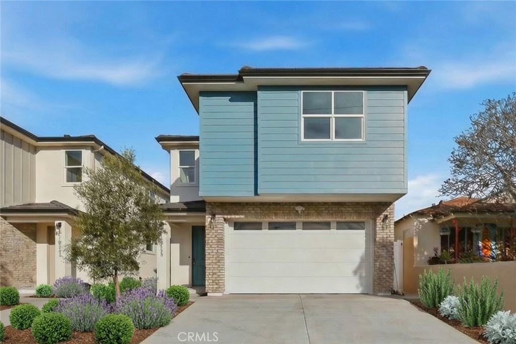 15538 Colorado Avenue Paramount, CA 90723 - Photo 1 of 1 a front view of house with street