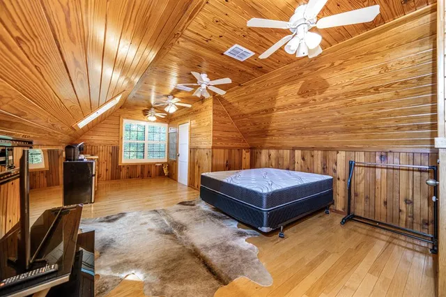 a backyard of a house with barbeque oven table and chairs
