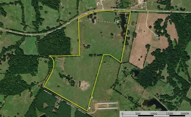 an aerial view of a residential houses with outdoor space