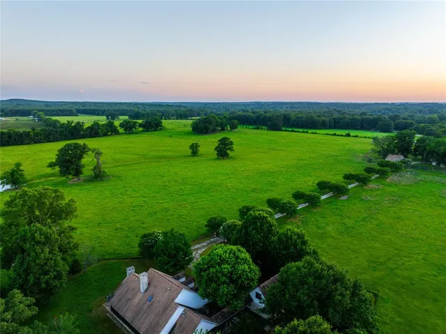 a view of a green field with clear sky