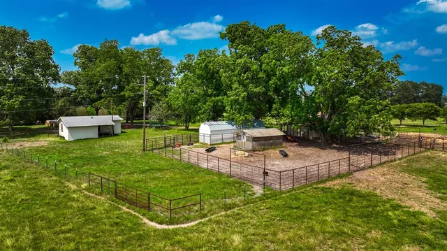 a view of a backyard with sitting area