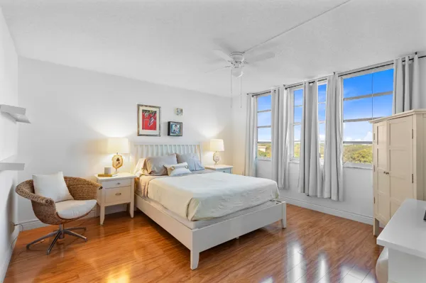 a bedroom with a bed and a chair
