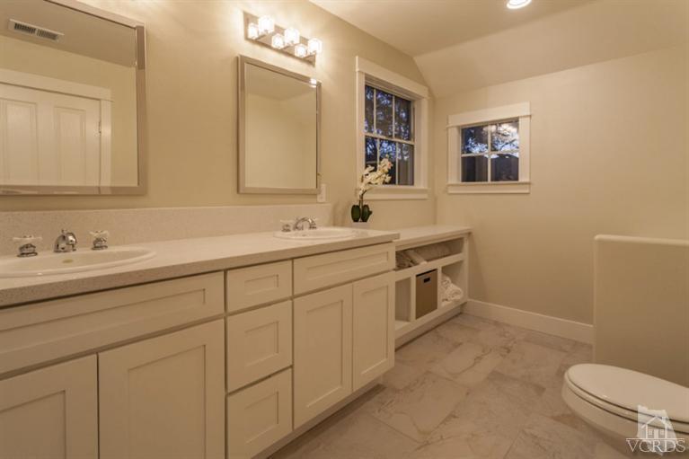 25029 Wheeler Road Newhall, CA 91321 - Photo 21 of 33 a spacious bathroom with a granite countertop sink a toilet and a mirror