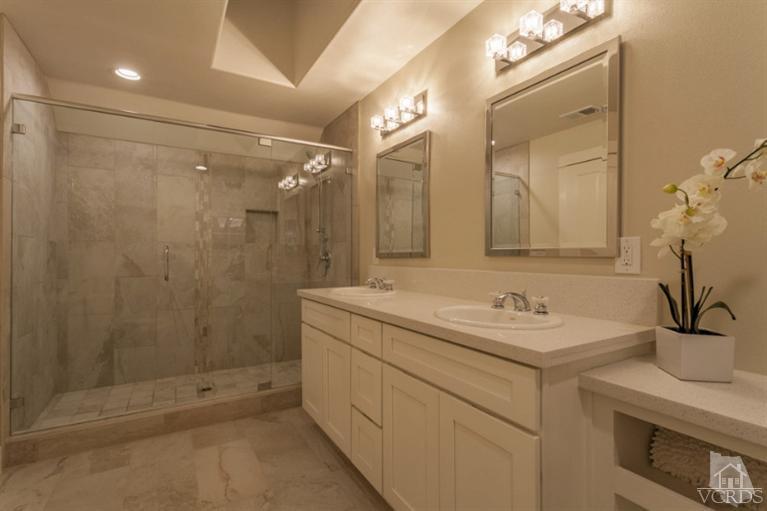 25029 Wheeler Road Newhall, CA 91321 - Photo 22 of 33 a bathroom with a sink and mirror