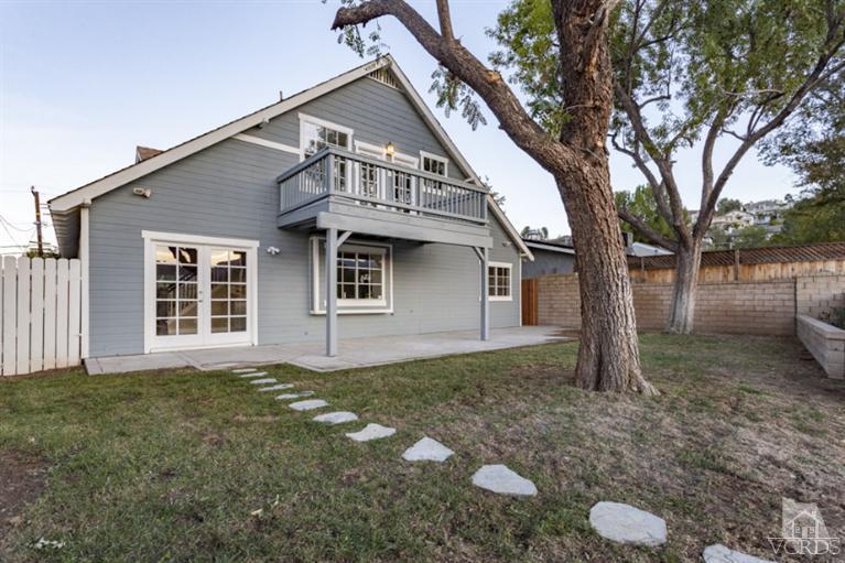 25029 Wheeler Road Newhall, CA 91321 - Photo 29 of 33 a front view of a house with a yard and garage