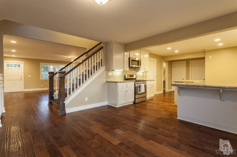 25029 Wheeler Road Newhall, CA 91321 - Photo 8 of 33 a view of kitchen with wooden floor and electronic appliances