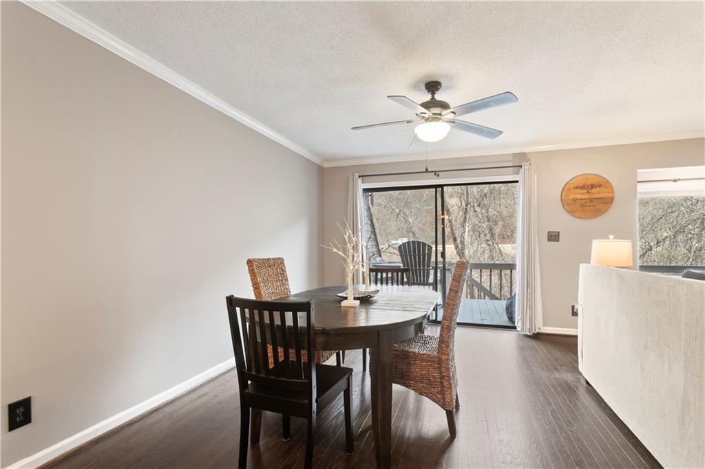 641 Riverside Drive Ellijay, GA 30540 - Photo 11 of 42 a dining room with furniture a chandelier and wooden floor
