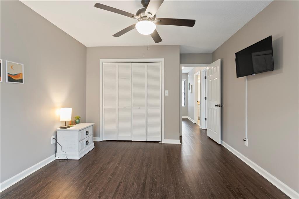 641 Riverside Drive Ellijay, GA 30540 - Photo 22 of 42 a hallway with wooden floor fireplace and a window