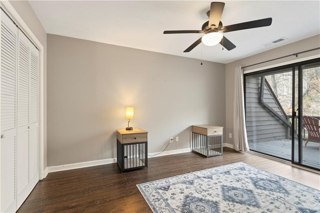 641 Riverside Drive Ellijay, GA 30540 - Photo 24 of 42 a bedroom with a bed and wooden floor