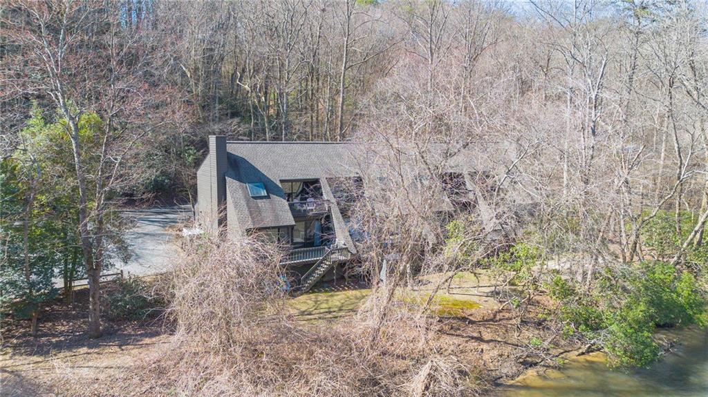 641 Riverside Drive Ellijay, GA 30540 - Photo 4 of 42 a view of house with trees in the background