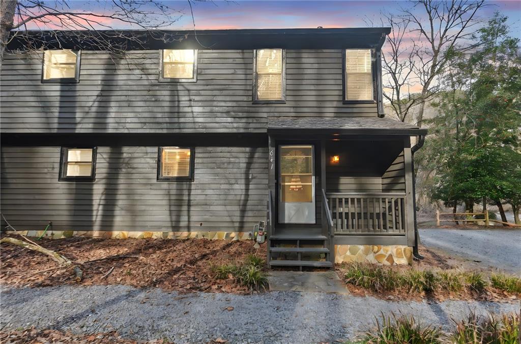 641 Riverside Drive Ellijay, GA 30540 - Photo 6 of 42 a front view of a house with garden