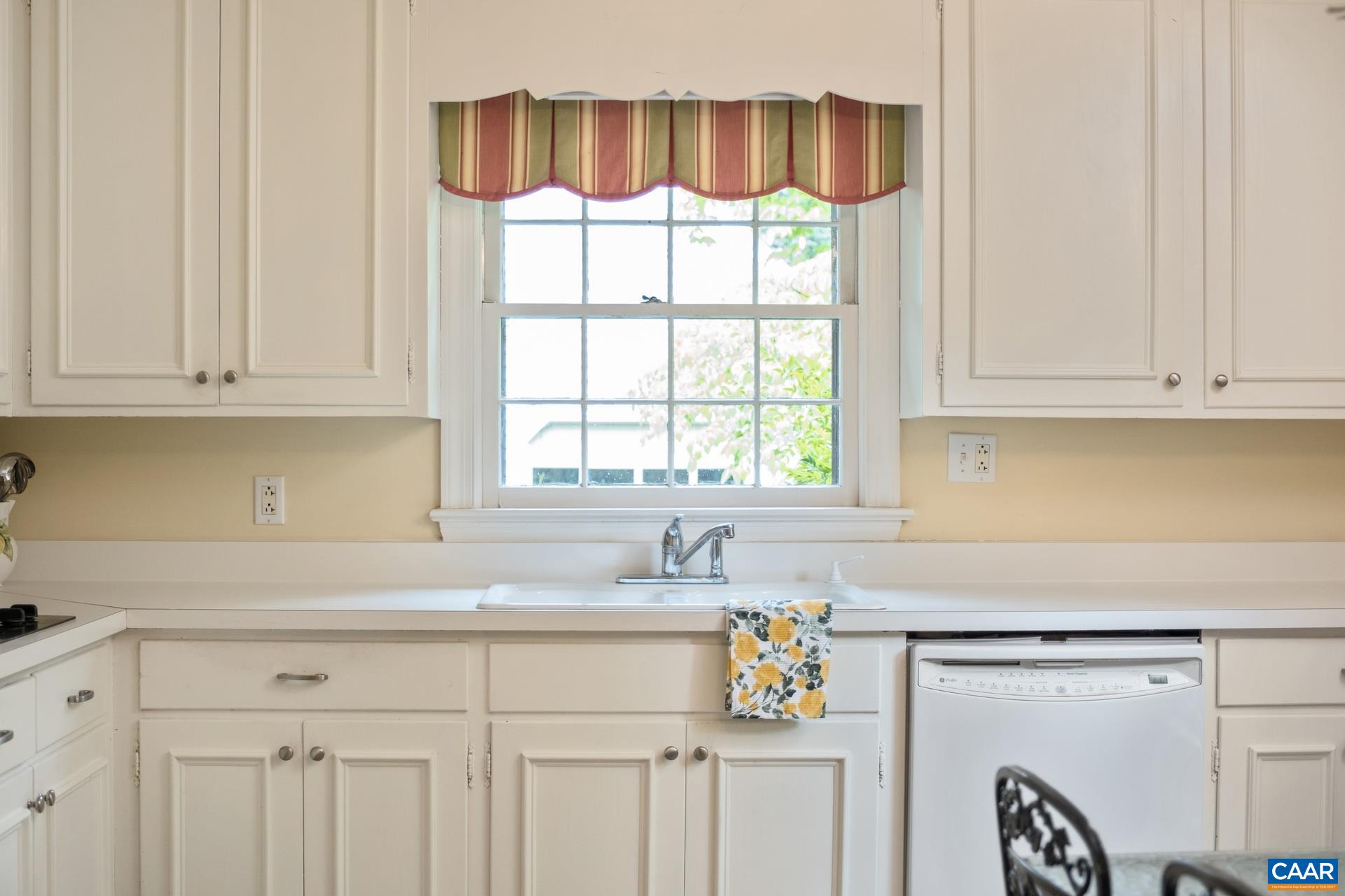 2509 Northfield Road Charlottesville, VA 22901 - Photo 11 of 44 a kitchen with stainless steel appliances granite countertop a sink and a window