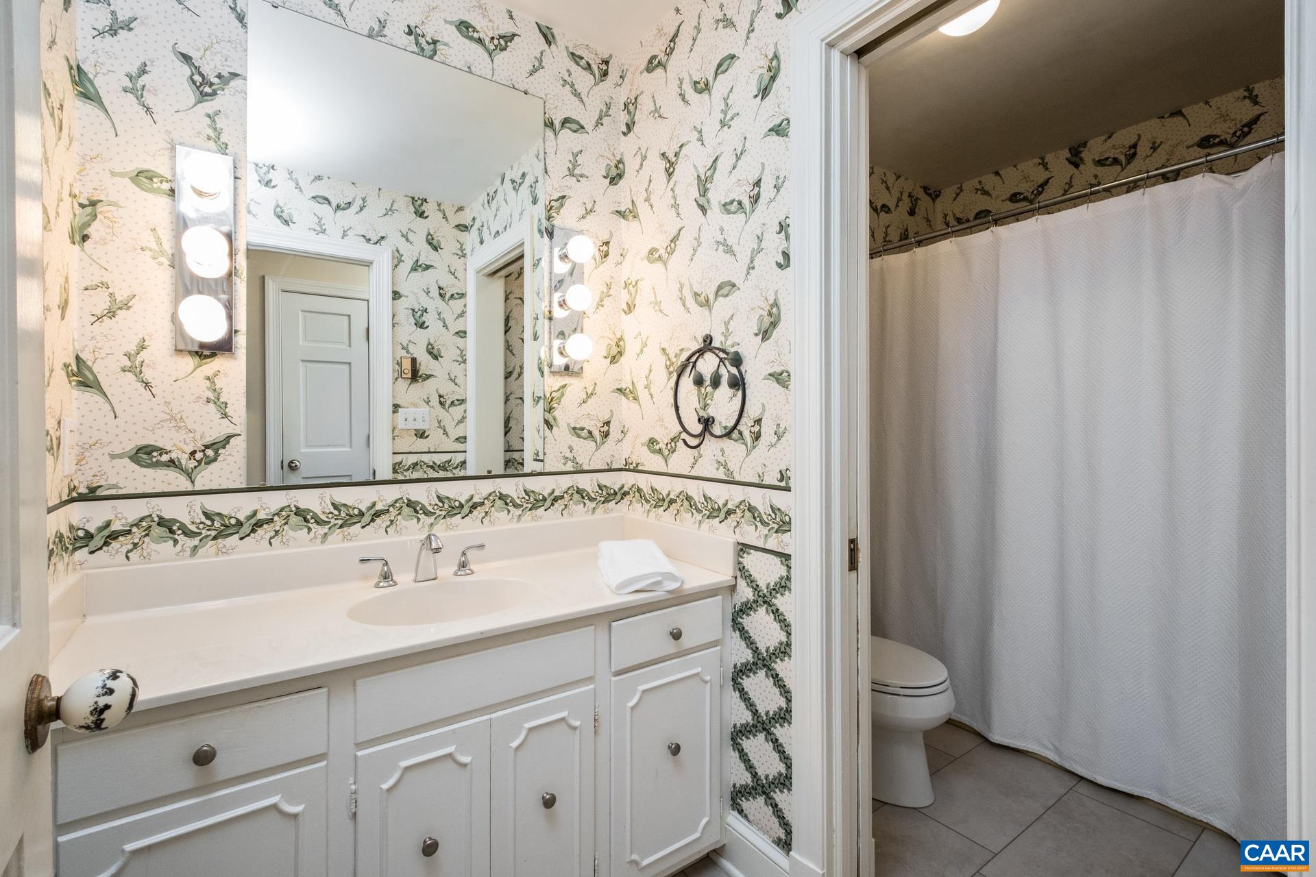 2509 Northfield Road Charlottesville, VA 22901 - Photo 17 of 44 a bathroom with a sink and a mirror