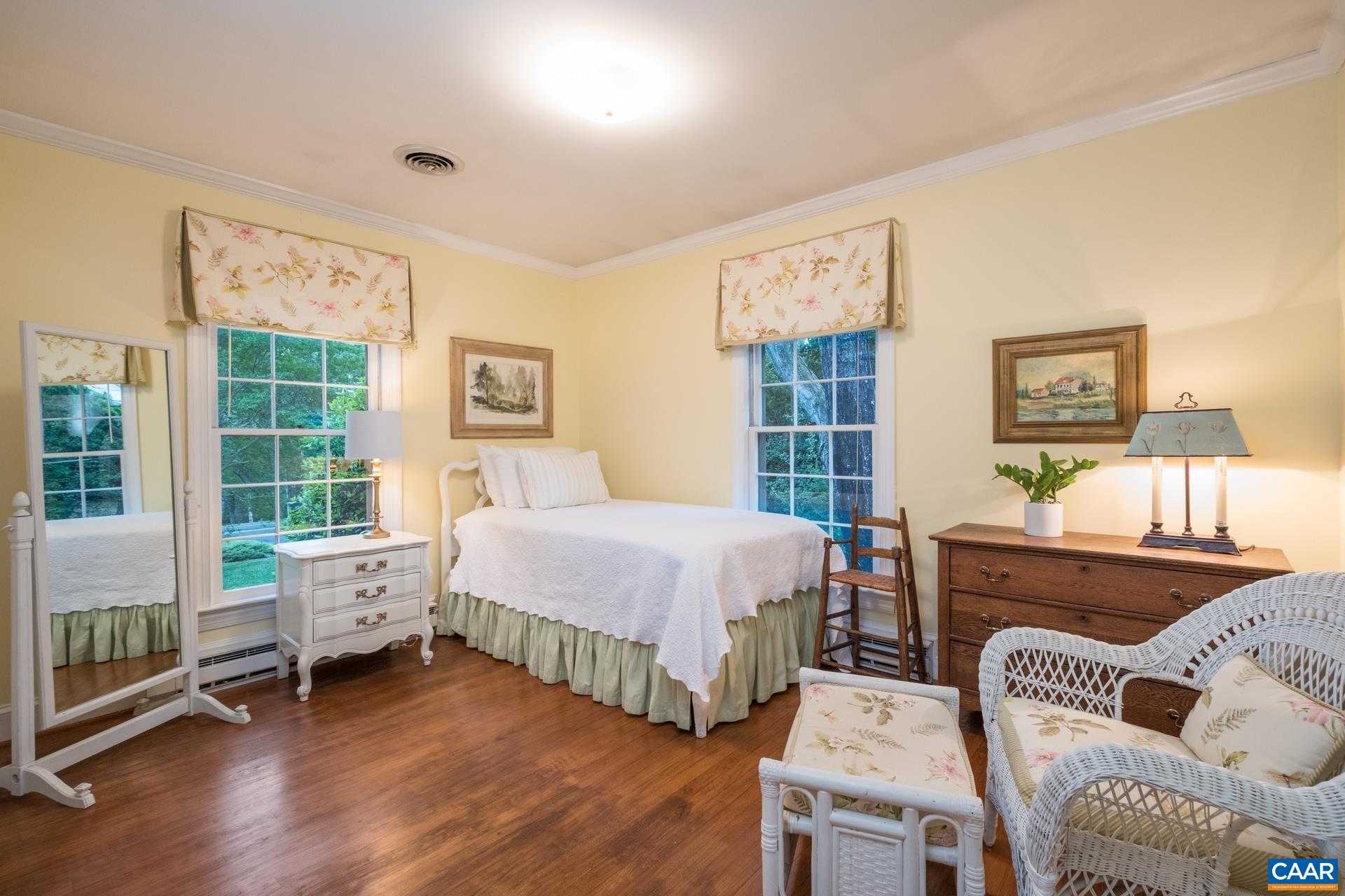 2509 Northfield Road Charlottesville, VA 22901 - Photo 19 of 44 a spacious bedroom with a bed and a couch