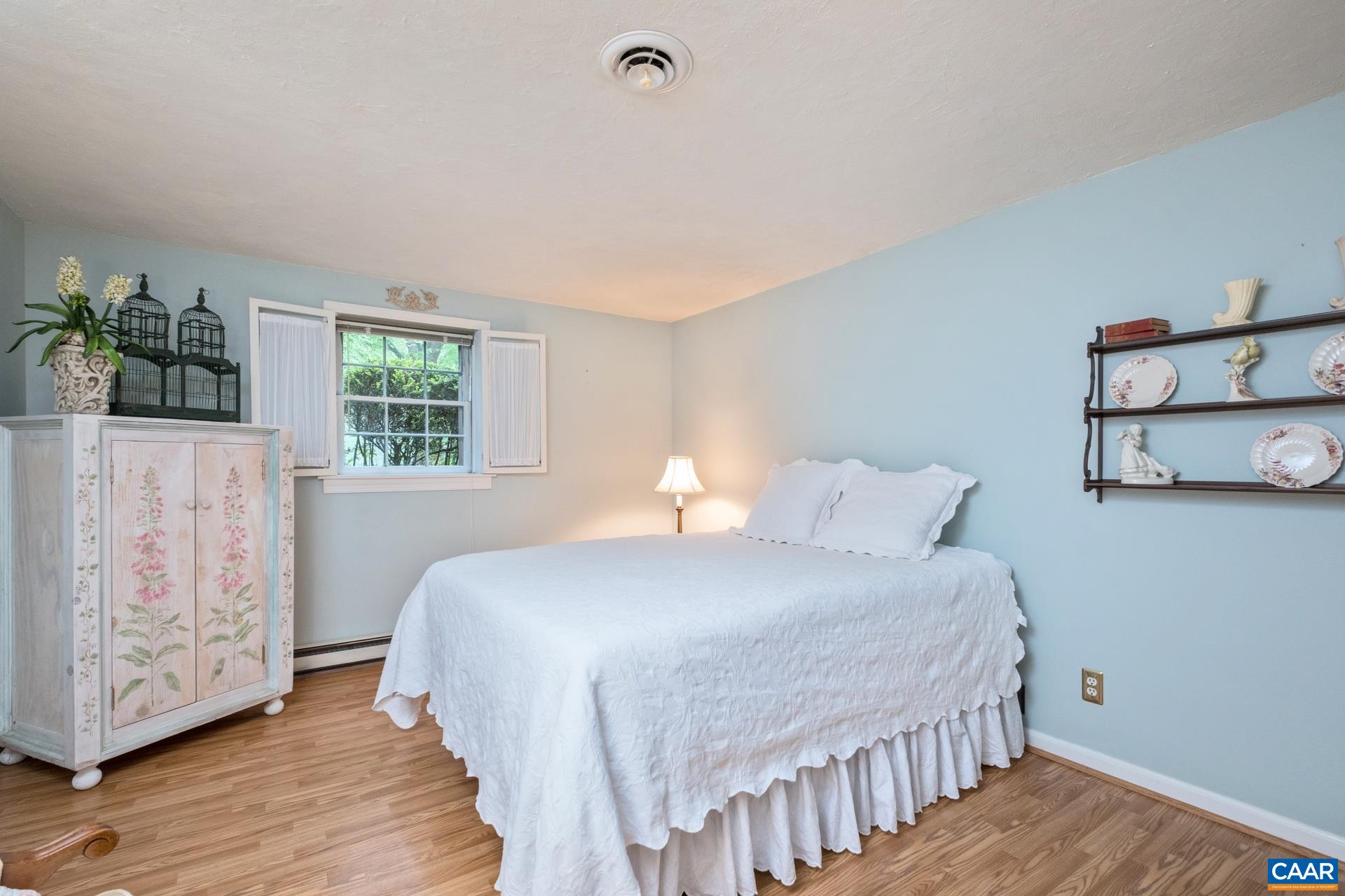 2509 Northfield Road Charlottesville, VA 22901 - Photo 24 of 44 a bedroom with a bed a window and potted plant