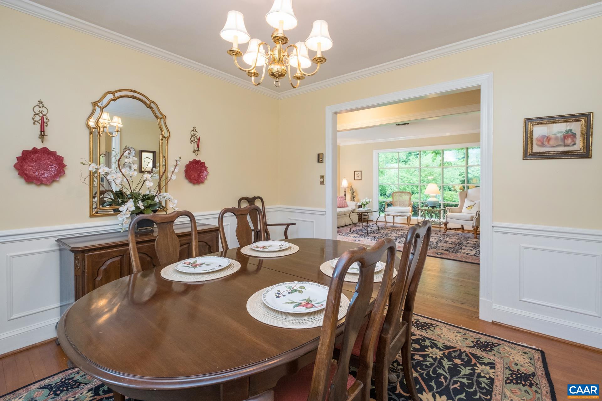 2509 Northfield Road Charlottesville, VA 22901 - Photo 7 of 44 a dining room with furniture a rug and wooden floor