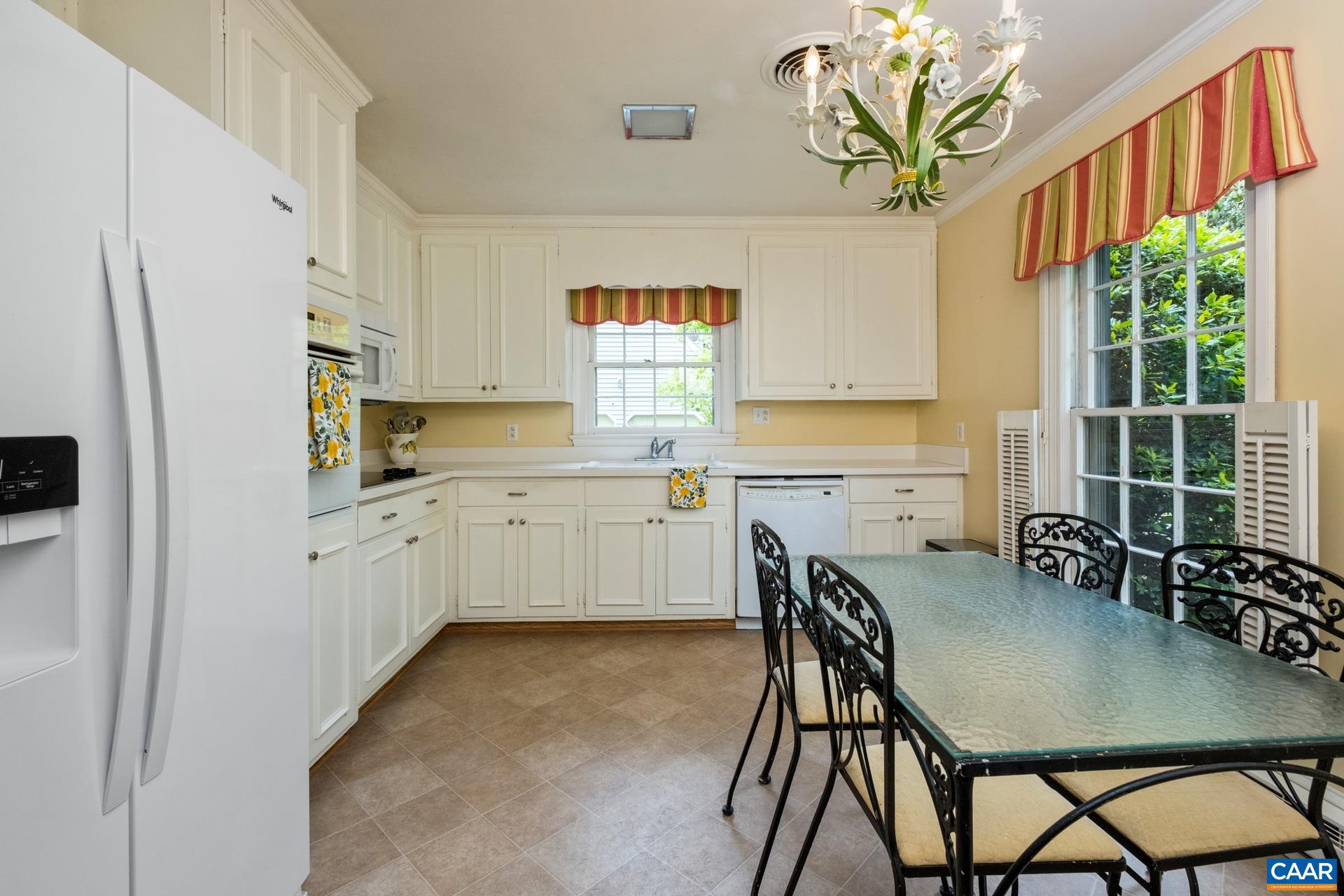 2509 Northfield Road Charlottesville, VA 22901 - Photo 10 of 44 a kitchen with stainless steel appliances a table and chairs in it