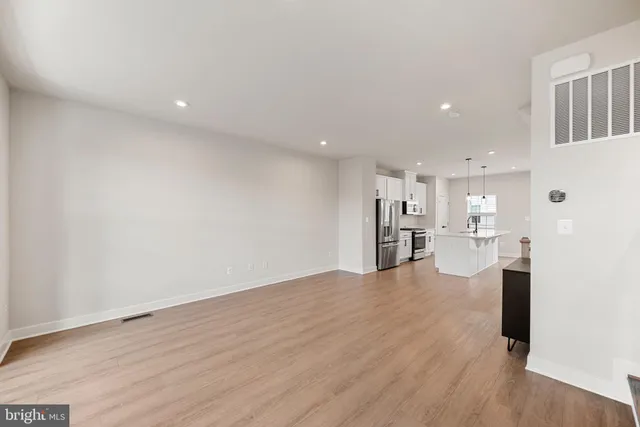 a view of a kitchen with wooden floor