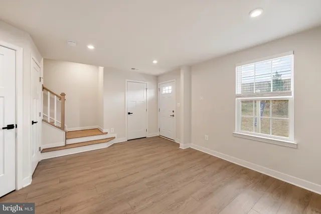 a couple of cars parked in front of a building