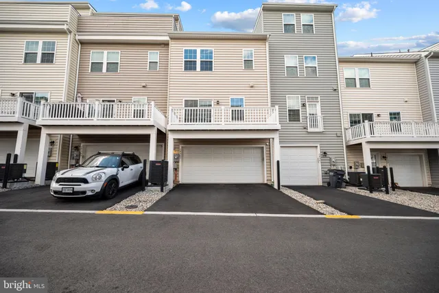 a front view of a house with a garage