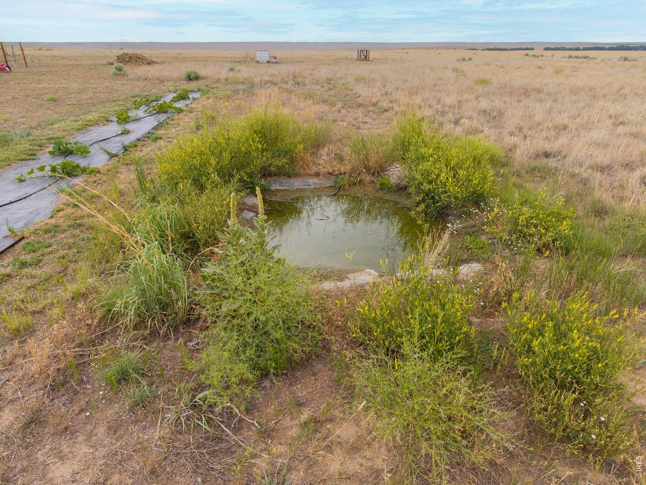 13550 Deter-Winters Road Byers, CO 80103 - Photo 40 of 50 This is the wildlife watering hole fed by a timed zone on the sprinkler system