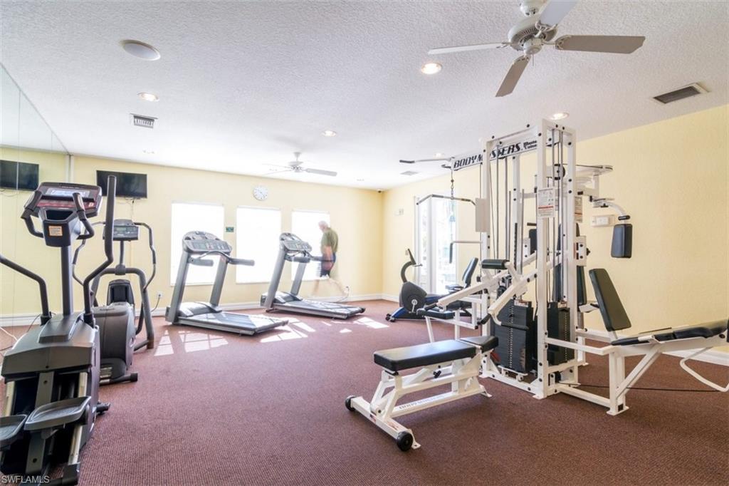 4635 St Croix Lane, Unit 1218 Naples, FL 34109 - Photo 32 of 40 Workout area with ceiling fan, a textured ceiling, and recessed lighting