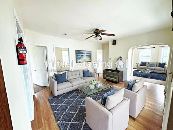 a living room with furniture and a flat screen tv