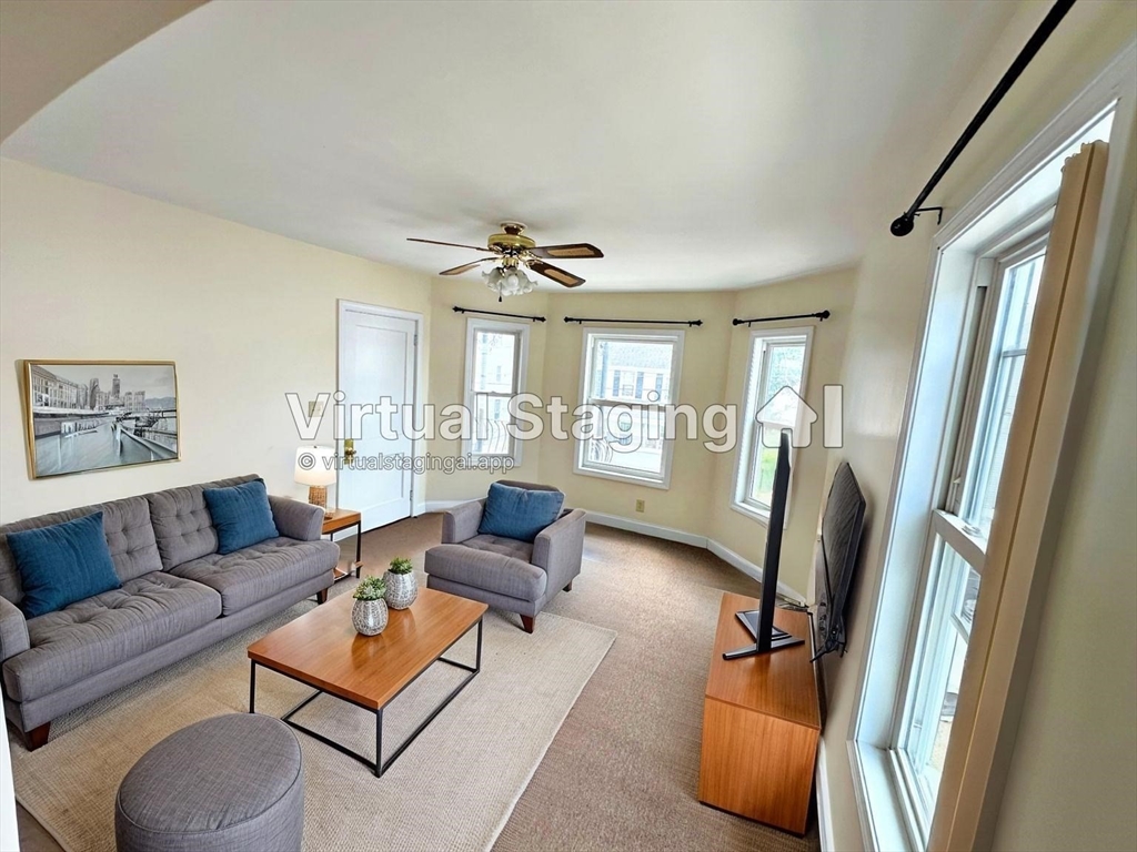 528 Lawton Street, Unit 2 Fall River, MA 02721 - Photo 9 of 20 a living room with furniture and a window