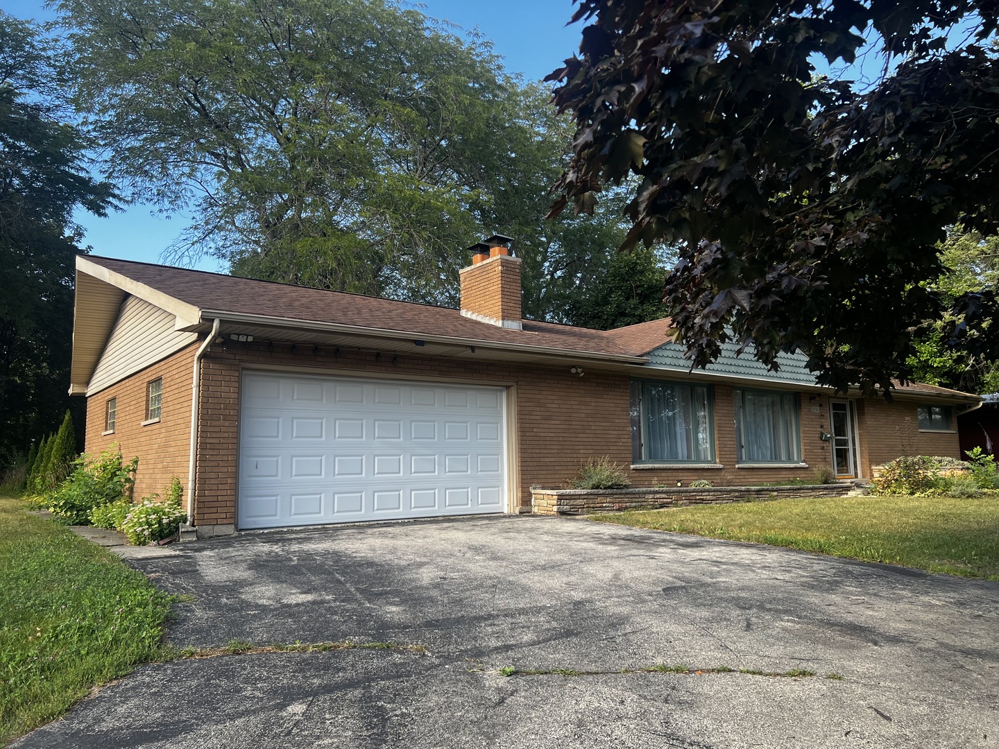 1930 23rd Street Zion, IL 60099 - Photo 2 of 18 a backyard of a house with yard and garage