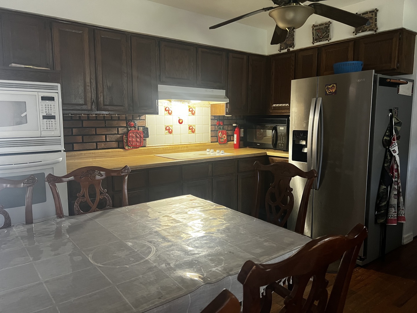 1930 23rd Street Zion, IL 60099 - Photo 5 of 18 a kitchen with stainless steel appliances a refrigerator a sink a stove and island