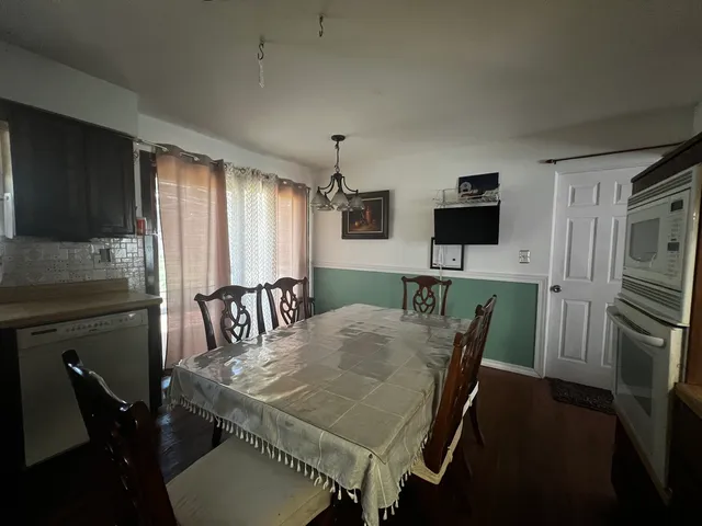 a view of a dining room with furniture