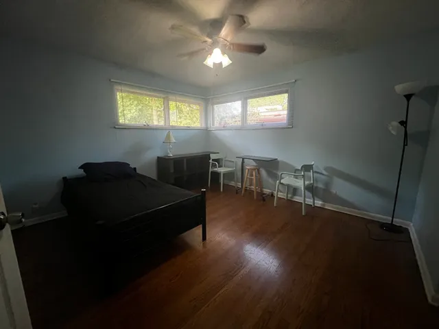 a living room with furniture window and wooden floor