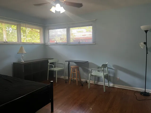a room with furniture and wooden floor