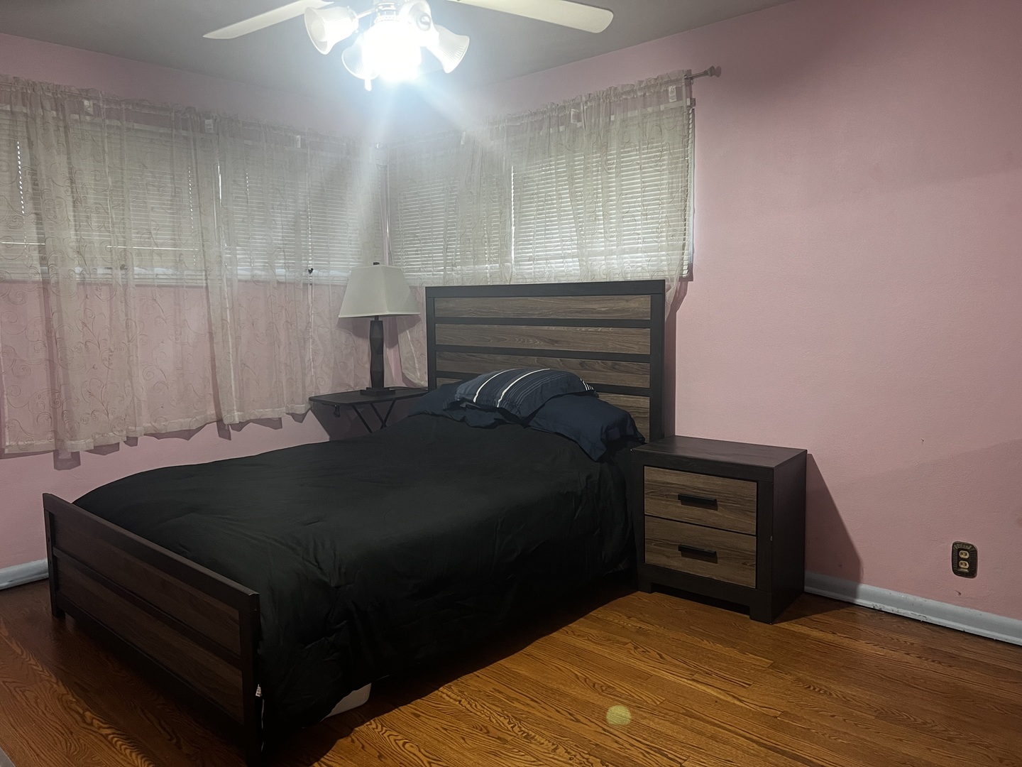 1930 23rd Street Zion, IL 60099 - Photo 10 of 18 a bed sitting in a bedroom next to a cabinet