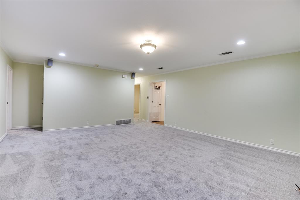 802 Cardinal Road Mansfield, TX 76063 - Photo 14 of 31 Empty room with recessed lighting, crown molding, and light carpet