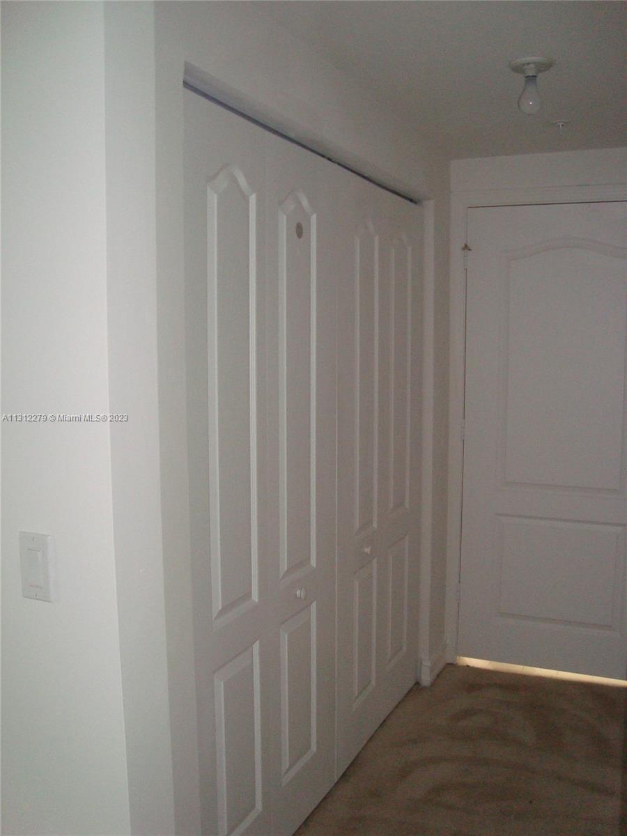 117 Northwest 42nd Avenue, Unit 1609 Miami, FL 33126 - Photo 5 of 15 a view of a wooden door