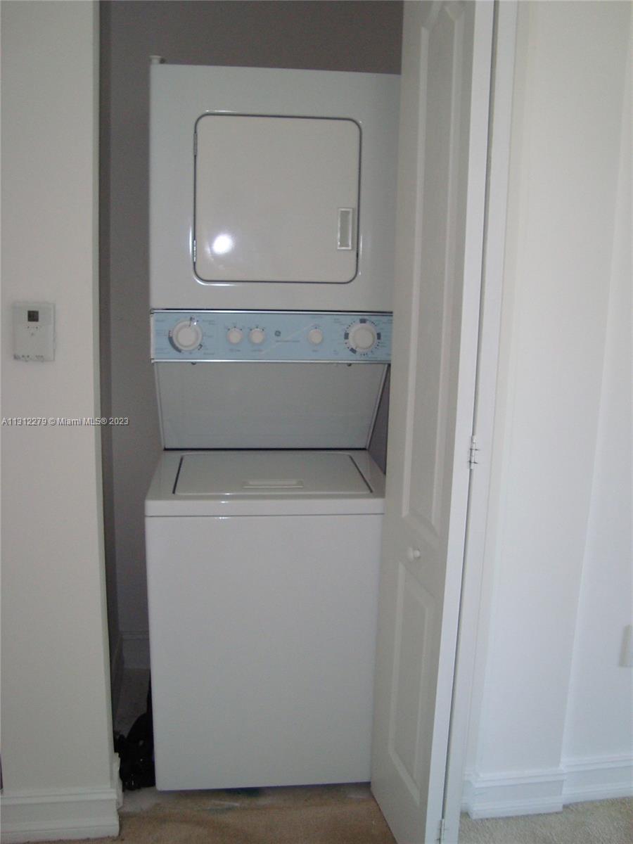 117 Northwest 42nd Avenue, Unit 1609 Miami, FL 33126 - Photo 6 of 15 a utility room with dryer and washer