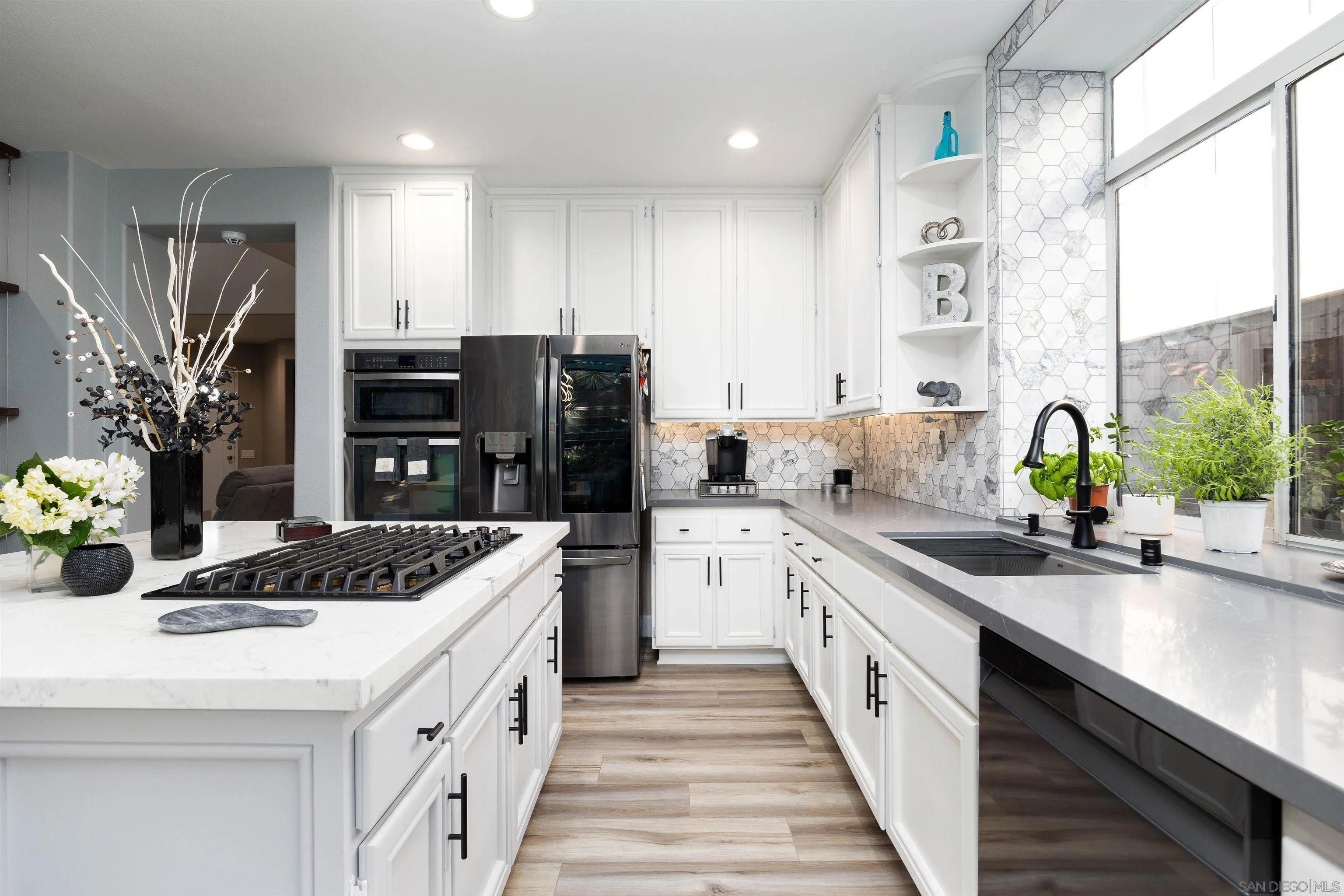 13835 Carmel Ridge Road San Diego, CA 92128 - Photo 11 of 38 a kitchen with a sink stove and refrigerator