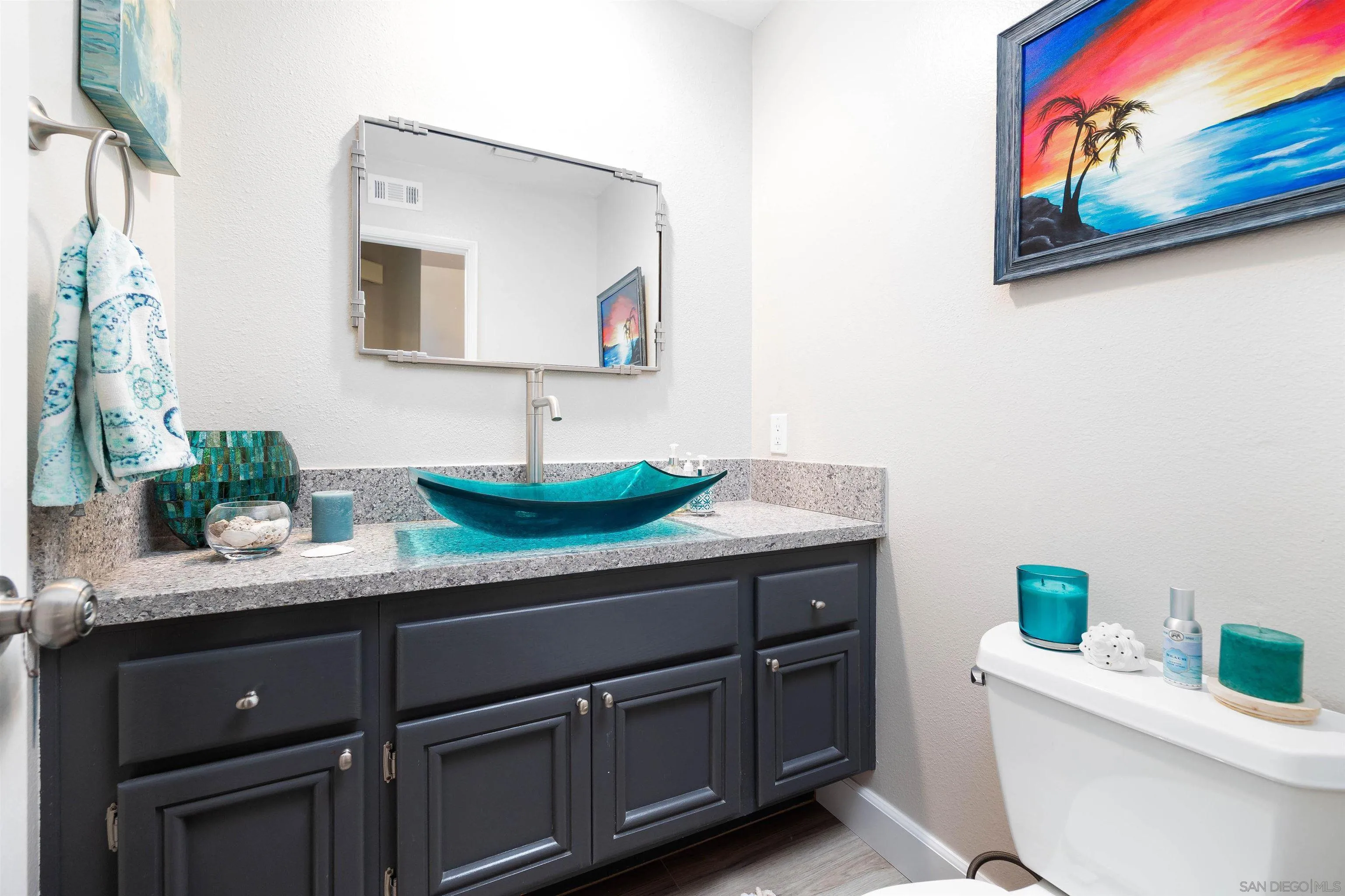 13835 Carmel Ridge Road San Diego, CA 92128 - Photo 14 of 38 a bathroom with a granite countertop sink and a mirror