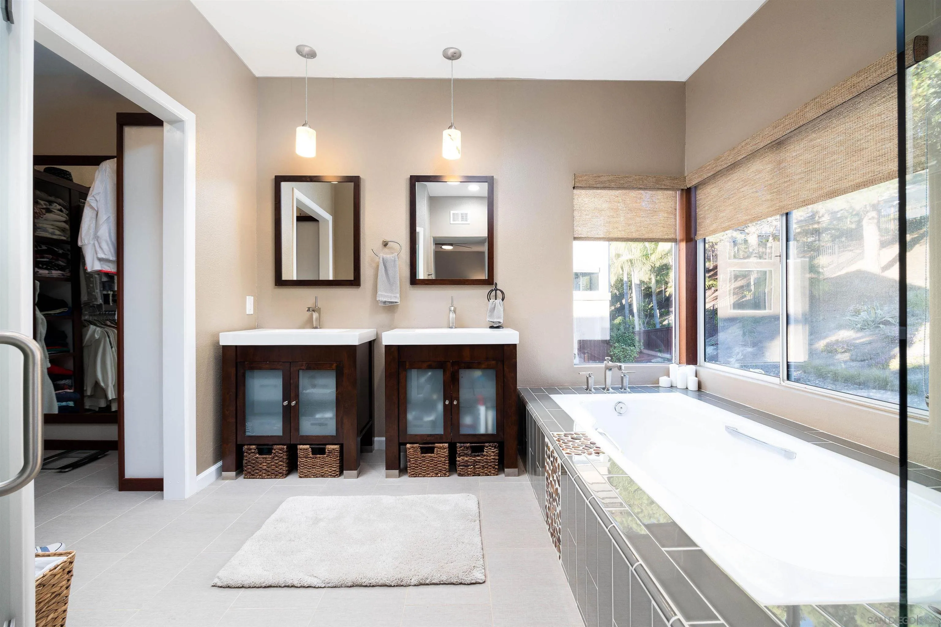 13835 Carmel Ridge Road San Diego, CA 92128 - Photo 18 of 38 a large white kitchen with granite countertop a sink and a large window