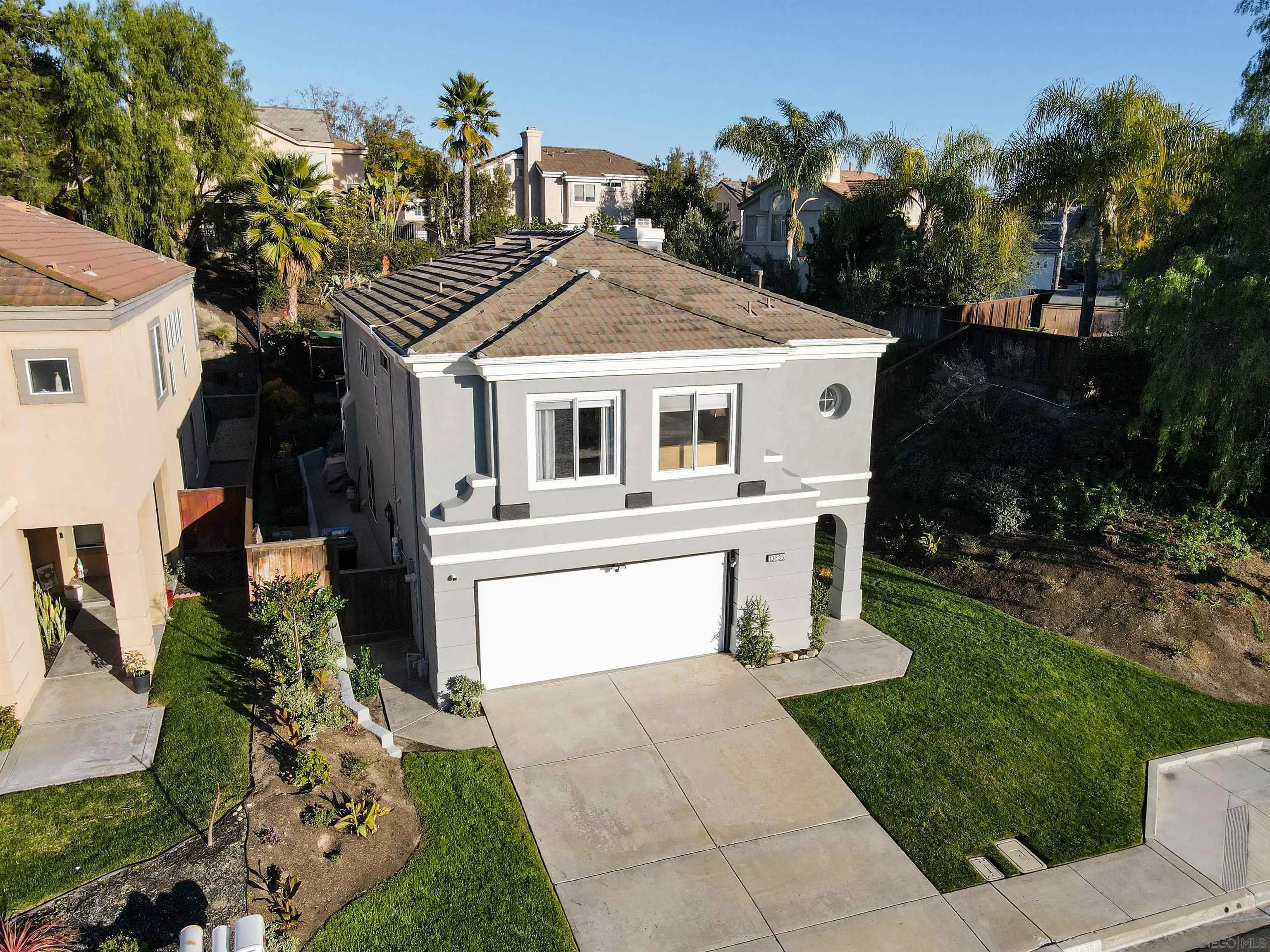 13835 Carmel Ridge Road San Diego, CA 92128 - Photo 32 of 38 a view of a house with a yard