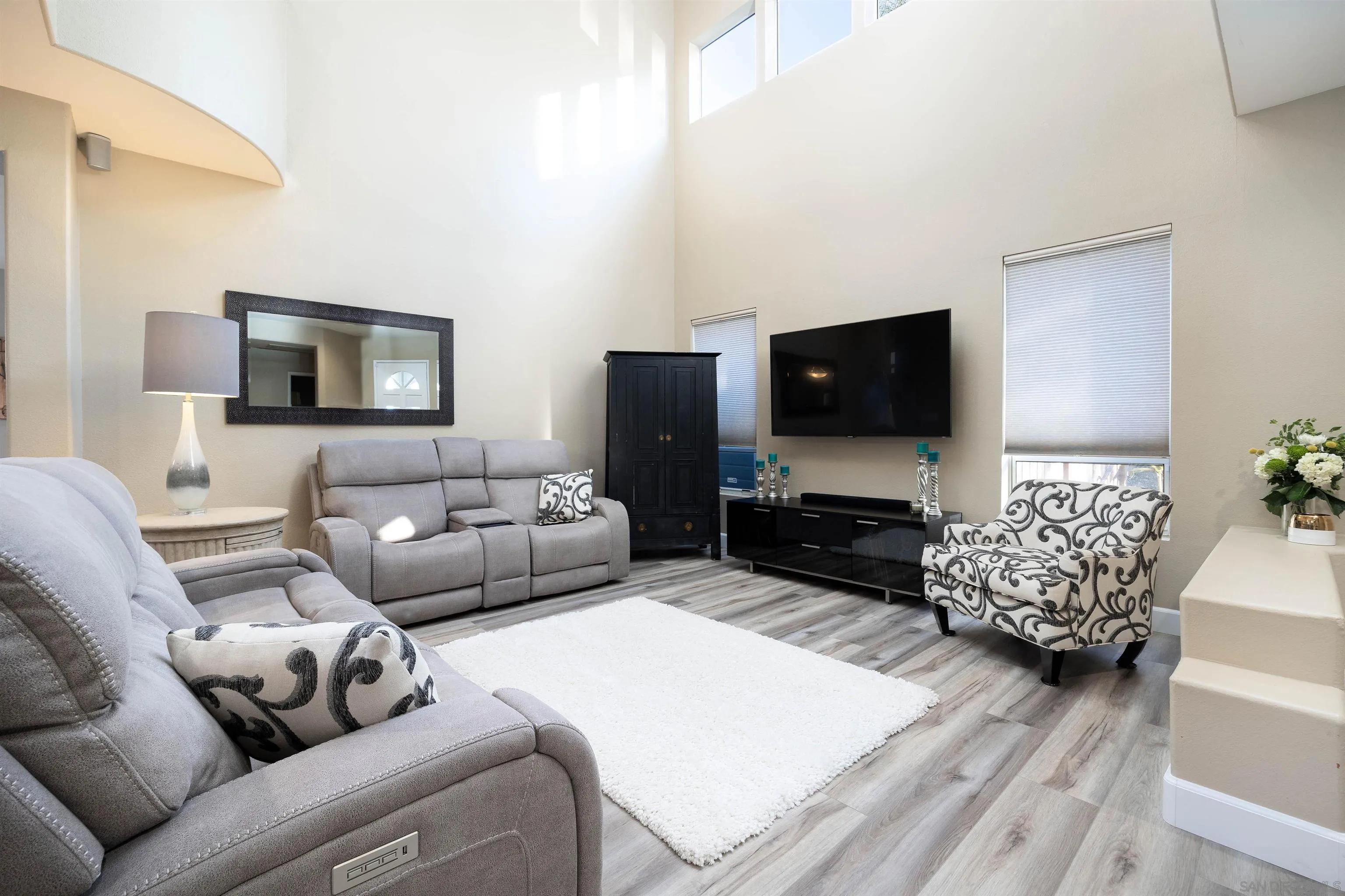 13835 Carmel Ridge Road San Diego, CA 92128 - Photo 5 of 38 a living room with furniture and a flat screen tv
